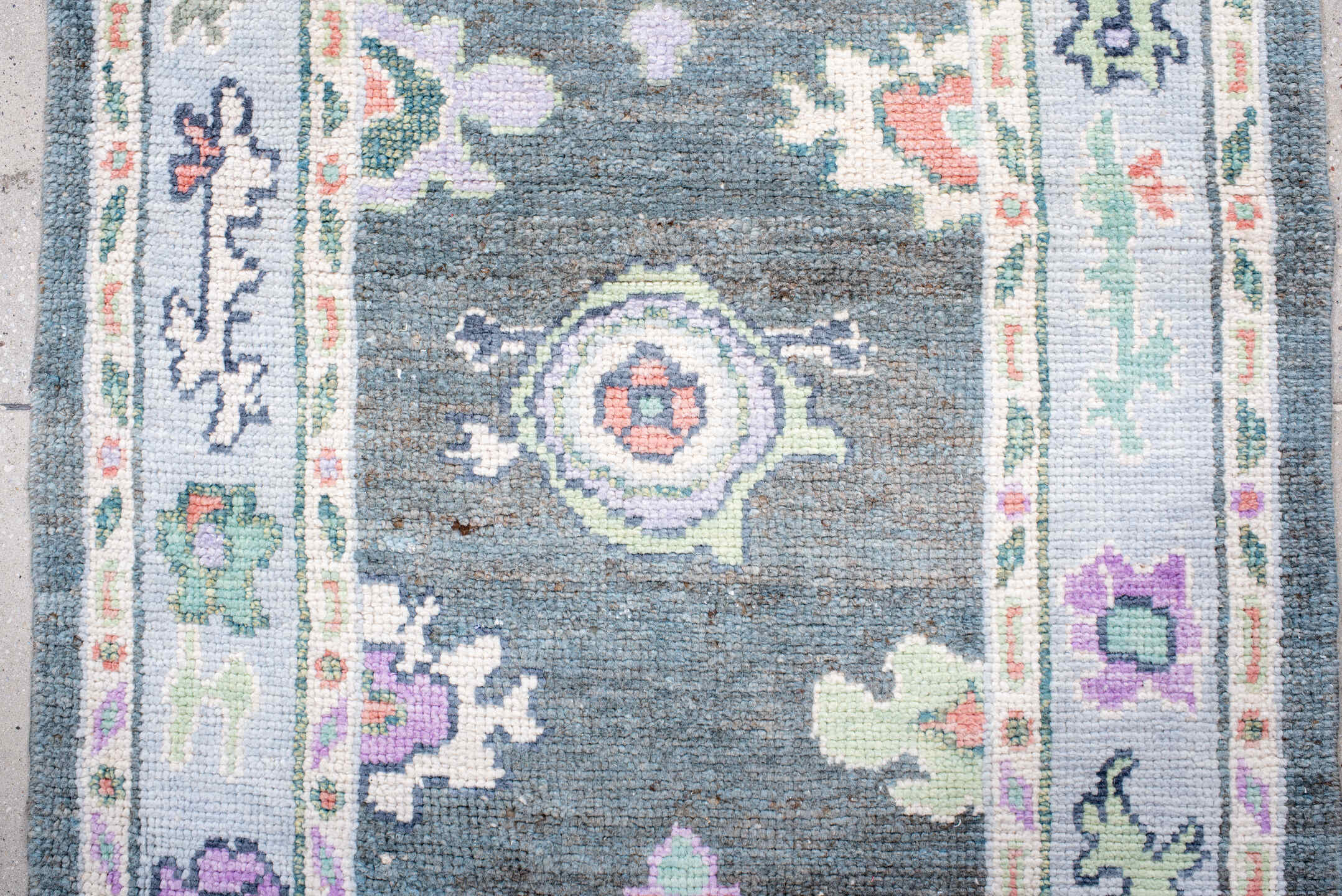 3' x 6' one-of-a-kind handmade vintage Oushak runner rug. Color palette: charcoal, ivory, lavender, sage, soft blue, coral