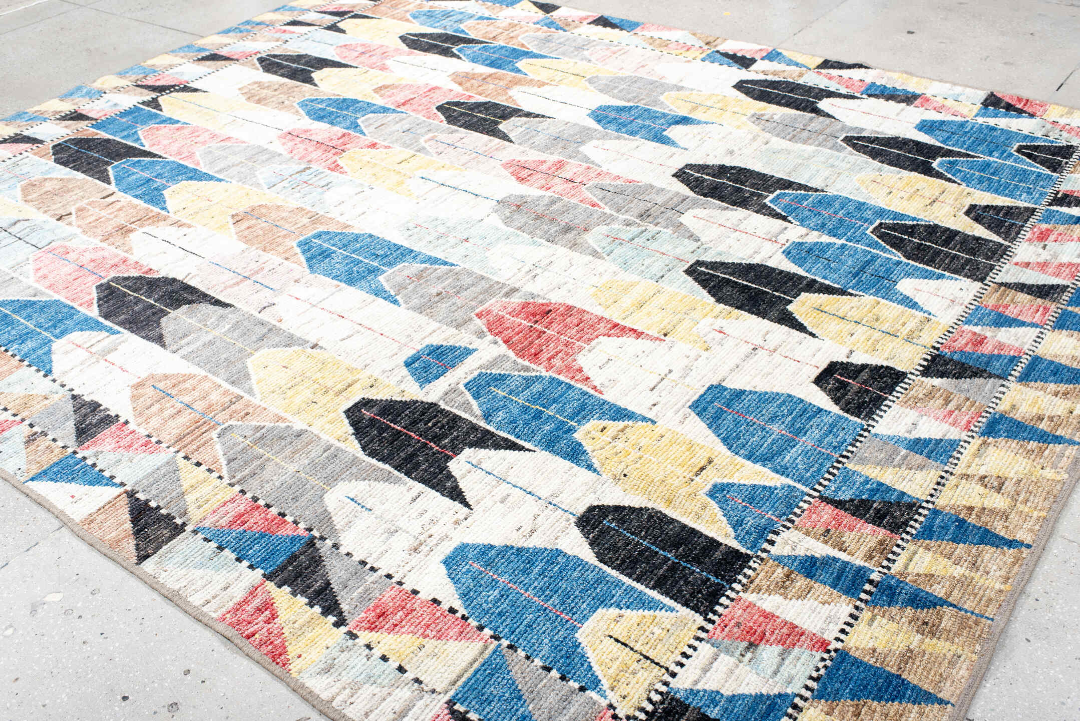 9' x 11' one-of-a-kind handmade vintage Tulu large size rug. Color palette: ivory, blue, charcoal, yellow, rose, taupe