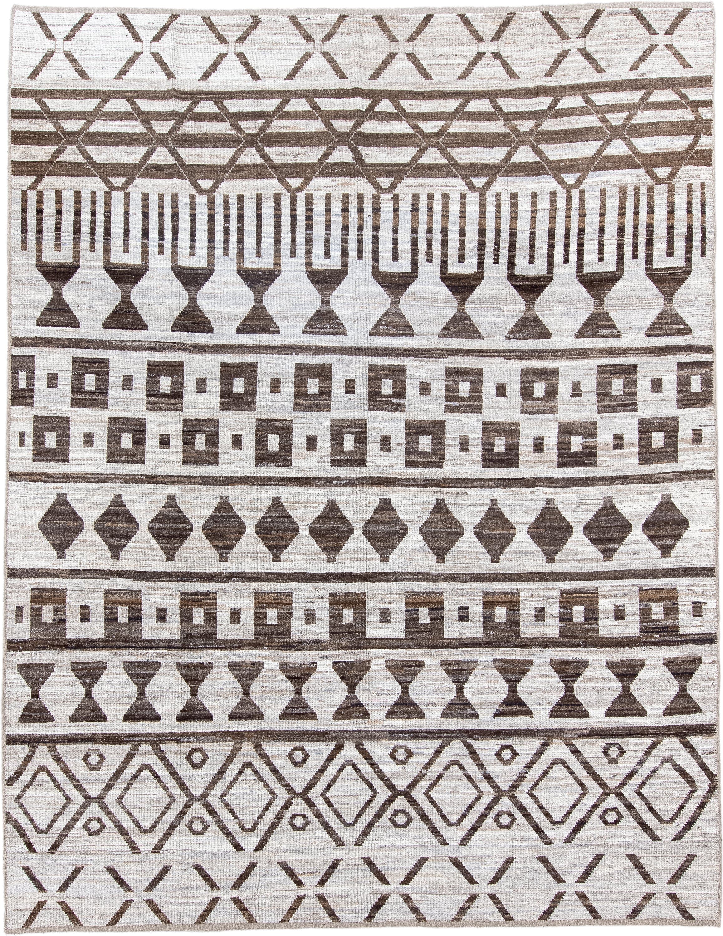 9' x 12' one-of-a-kind handmade vintage Tulu large size rug. Color palette: ivory, brown, taupe, beige, gray