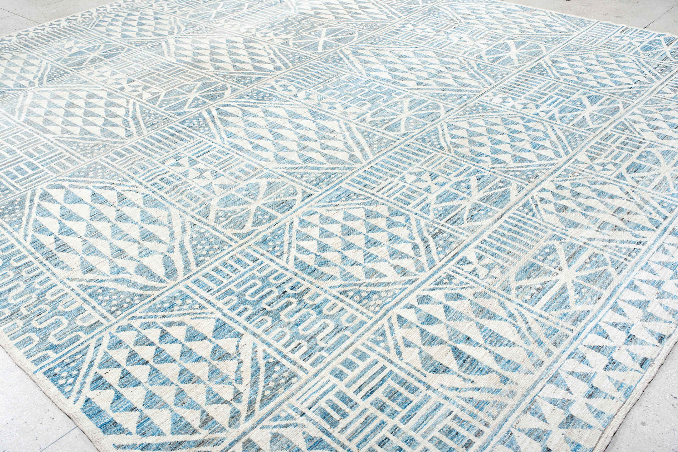12' x 14' one-of-a-kind handmade vintage Tulu oversize rug. Color palette: ivory, sky blue, powder blue, light blue