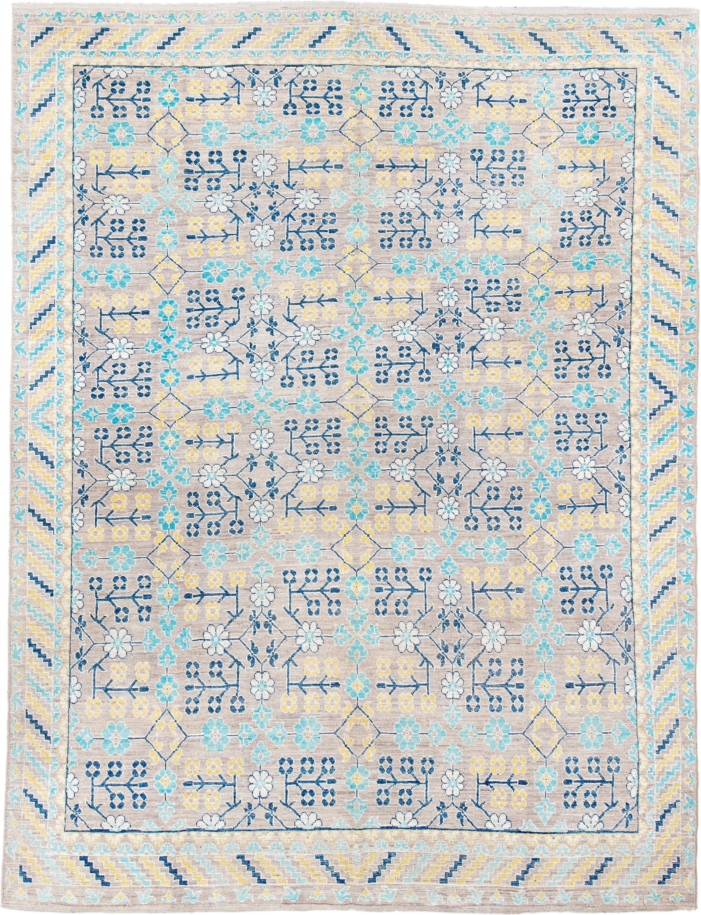 9' x 12' one-of-a-kind handmade vintage Khotan large size rug. Color palette: ivory, sky_blue, navy, pale_gold, taupe, cream