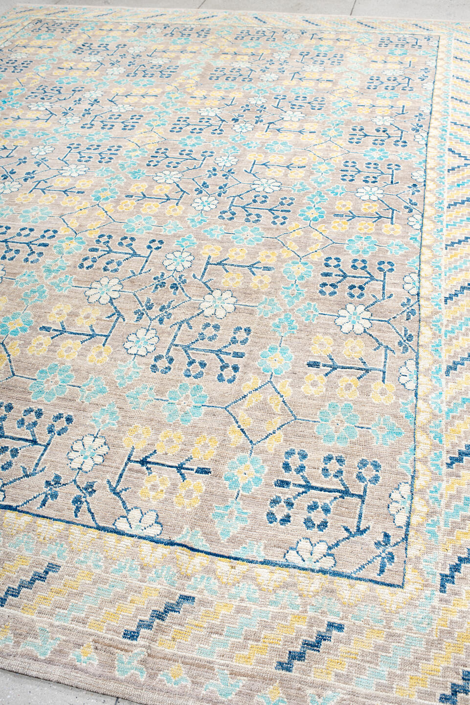 9' x 12' one-of-a-kind handmade vintage Khotan large size rug. Color palette: antiquewhite, blue, brown, cornsilk, dark gray