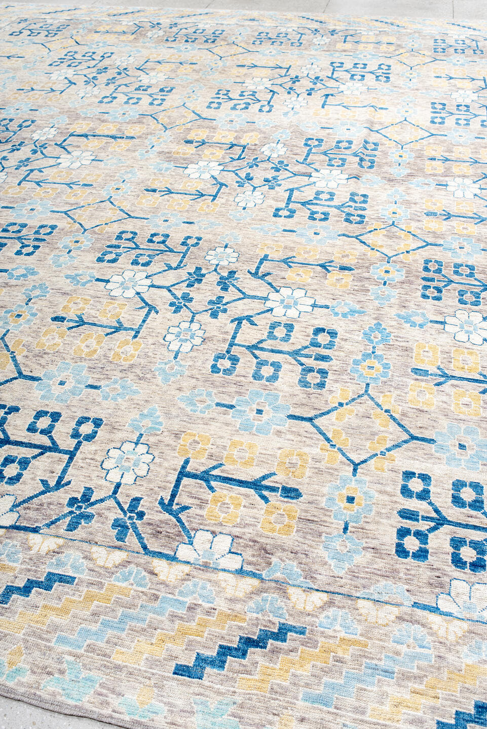 13' x 17' one-of-a-kind handmade vintage Khotan oversize rug. Color palette: ivory, light blue, cobalt, gold, taupe, blue