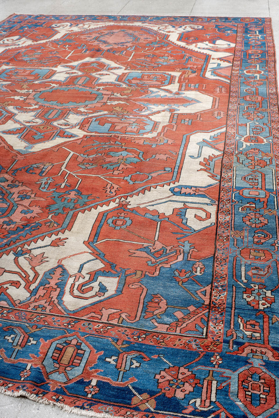 10' x 15' one-of-a-kind handmade vintage Serapi rug. Color palette: terra cotta, sky blue, ivory, rose, rust, camel