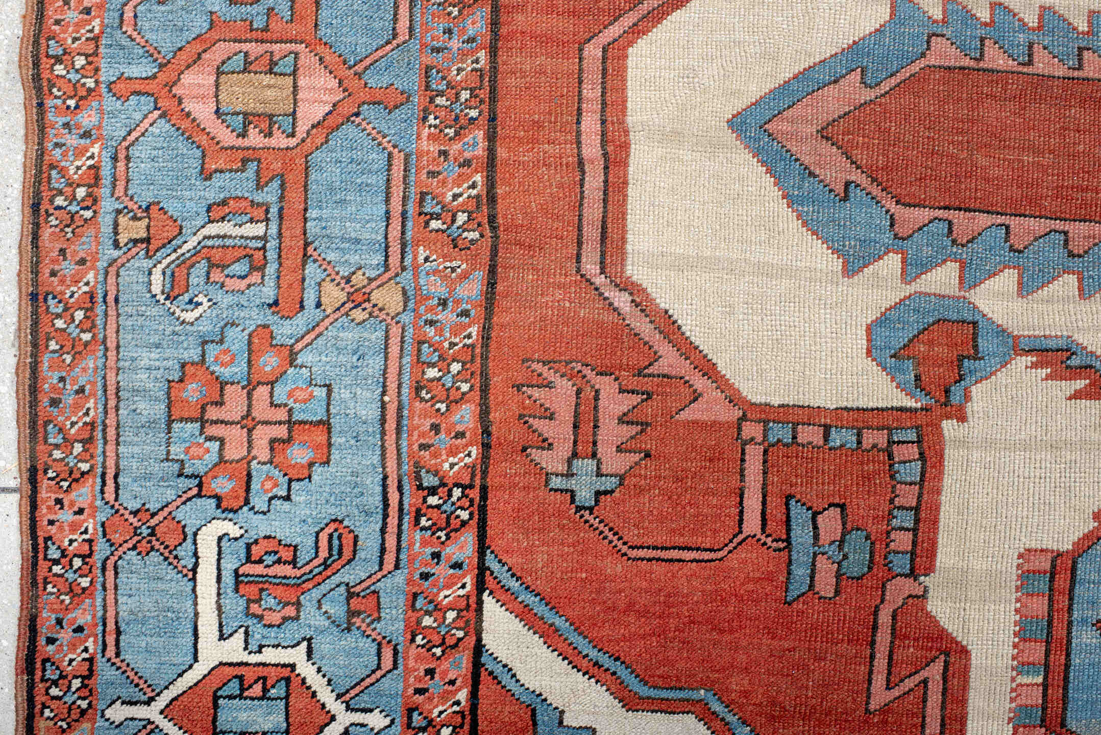 10' x 15' one-of-a-kind handmade vintage Serapi rug. Color palette: terra cotta, sky blue, ivory, rose, rust, camel