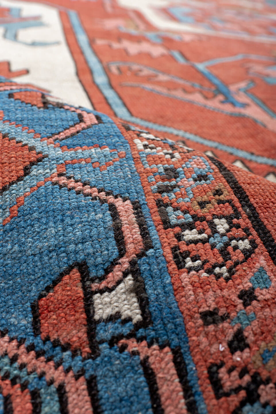 10' x 15' one-of-a-kind handmade vintage Serapi rug. Color palette: terra cotta, sky blue, ivory, rose, rust, camel