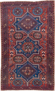 7' x 12' one-of-a-kind handmade vintage Sumak large size rug. Color palette: rust, indigo, navy, ivory, burgundy, teal