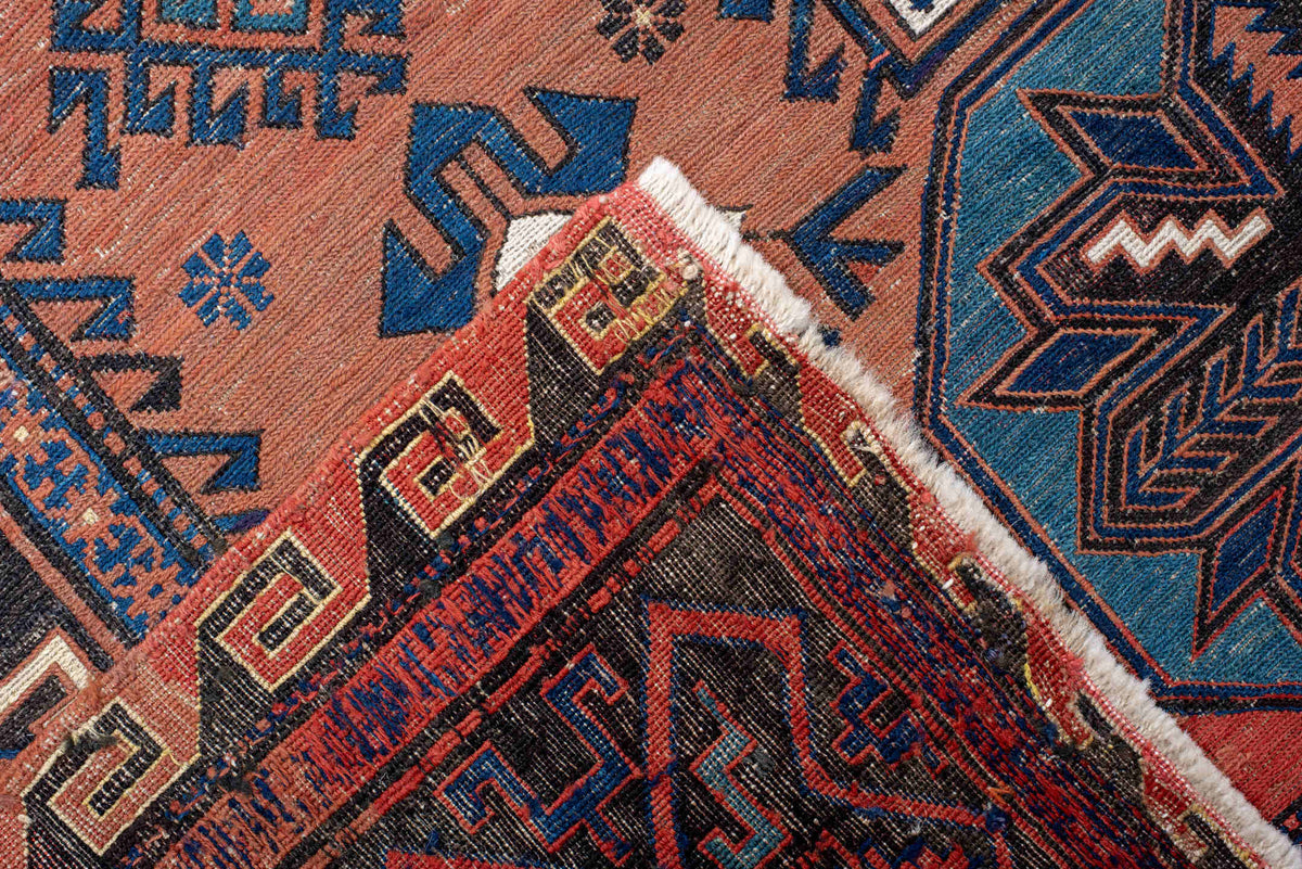 7' x 12' one-of-a-kind handmade vintage Sumak large size rug. Color palette: rust, indigo, navy, ivory, burgundy, teal