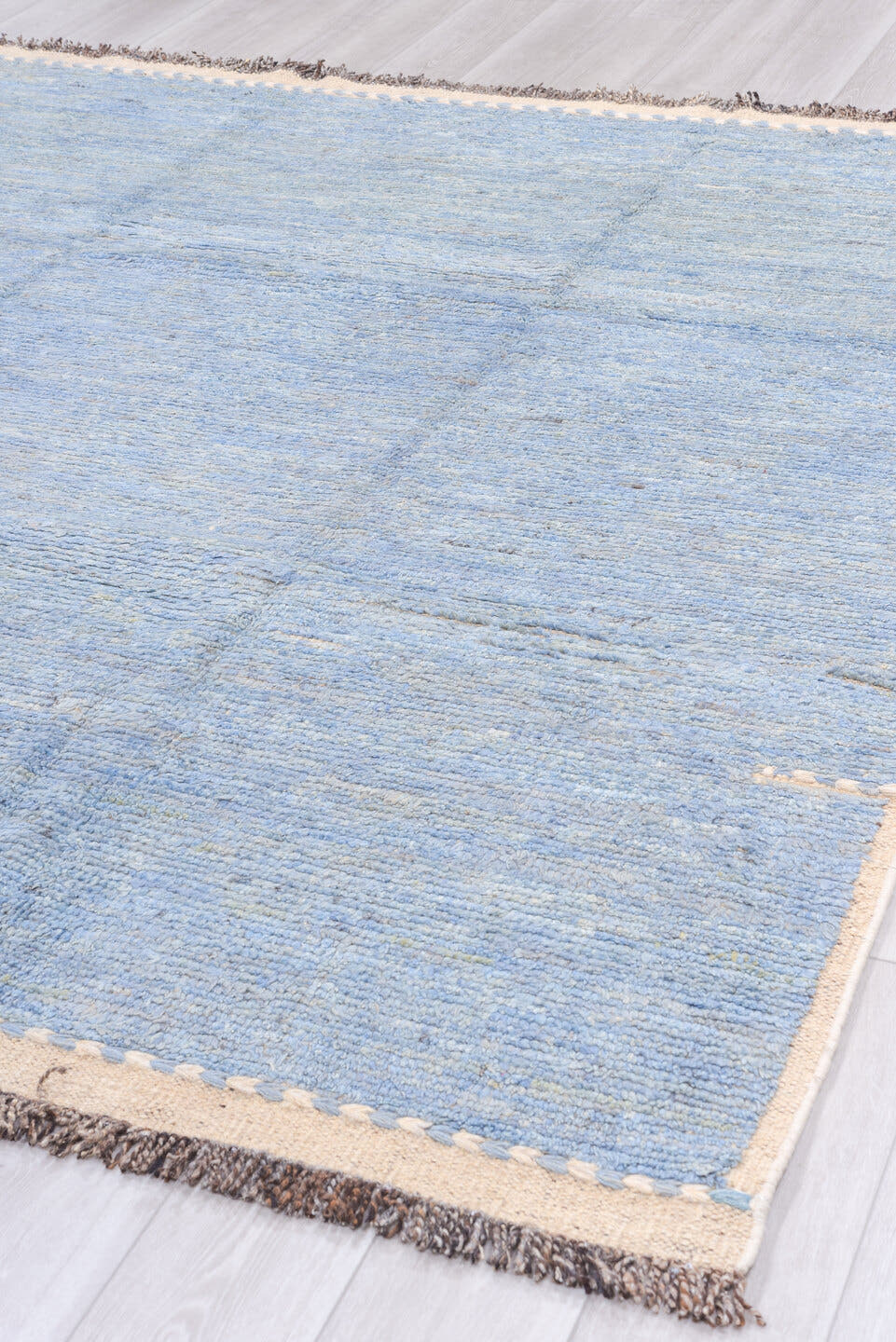 8' x 9' one-of-a-kind handmade vintage Tulu rug. Color palette: pale blue, ivory, charcoal, sky blue, light blue, gray