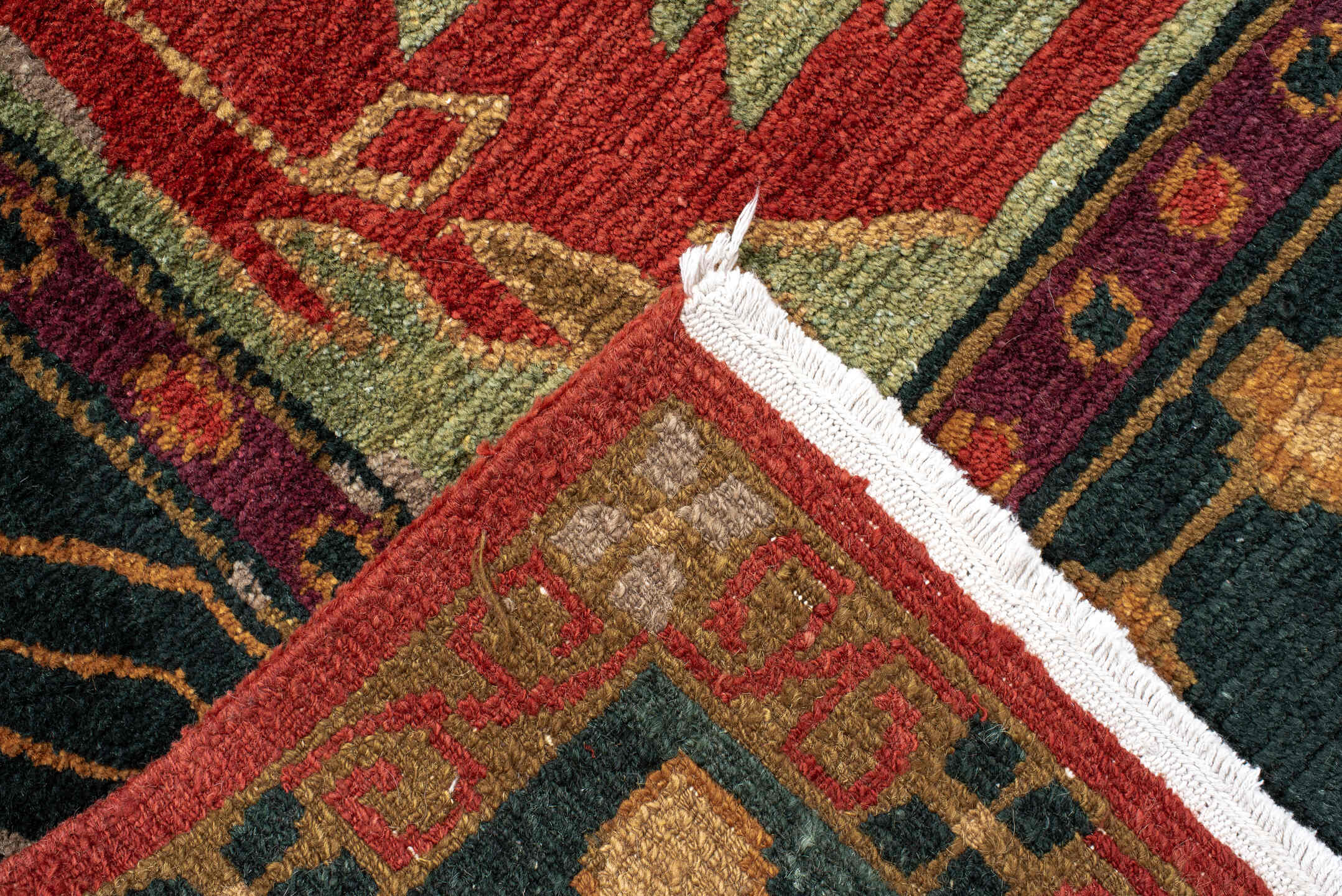 9' x 13' one-of-a-kind handmade vintage Donegal large size rug. Color palette: rust, navy, ivory, sage, peach, burgundy