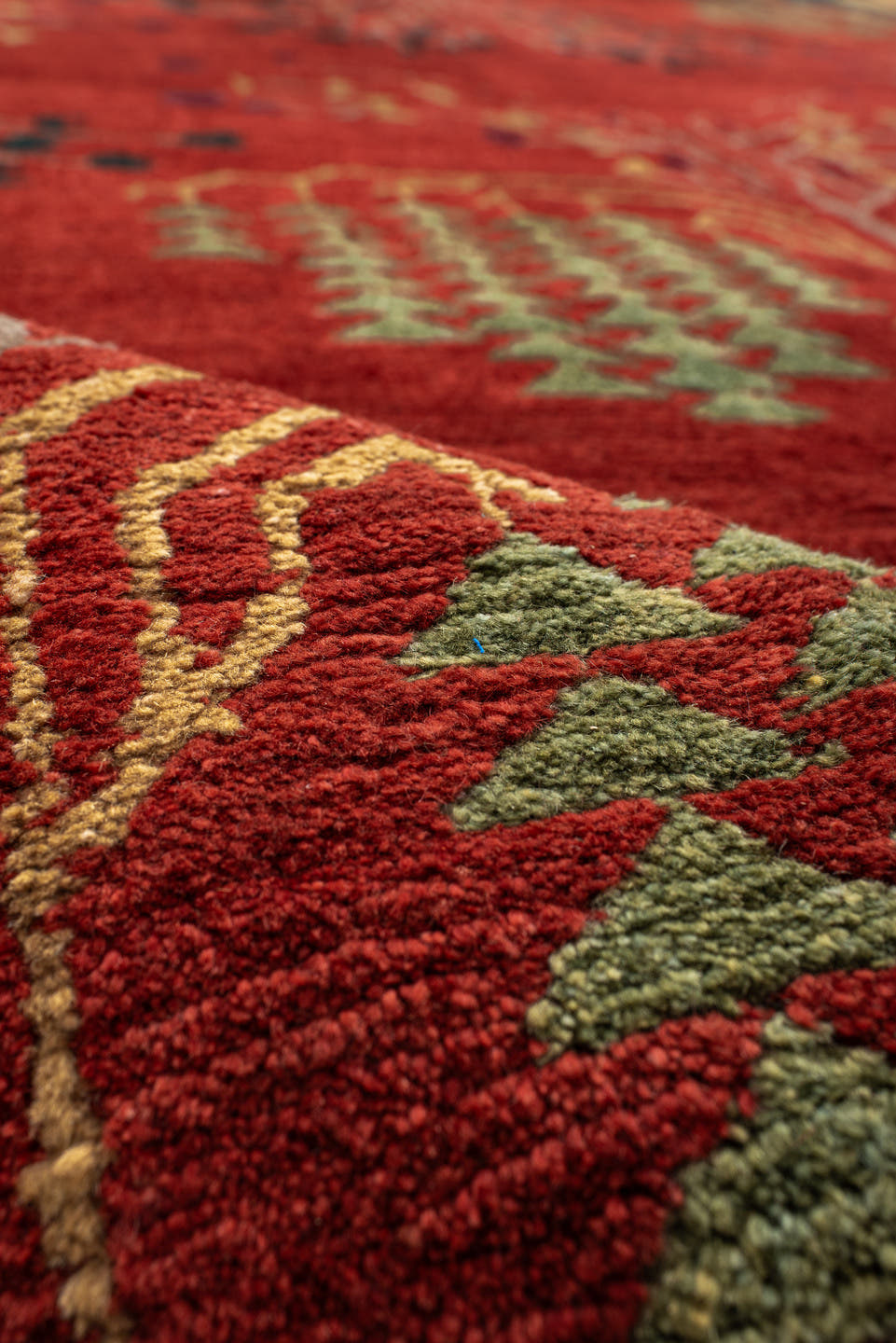 9' x 13' one-of-a-kind handmade vintage Donegal large size rug. Color palette: rust, navy, ivory, sage, peach, burgundy