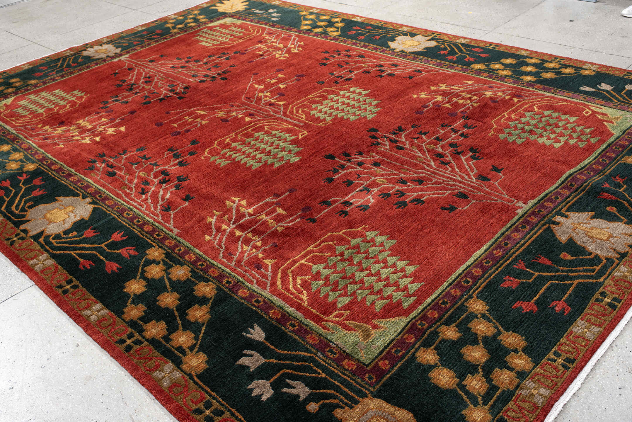 9' x 13' one-of-a-kind handmade vintage Donegal large size rug. Color palette: rust, navy, ivory, sage, peach, burgundy
