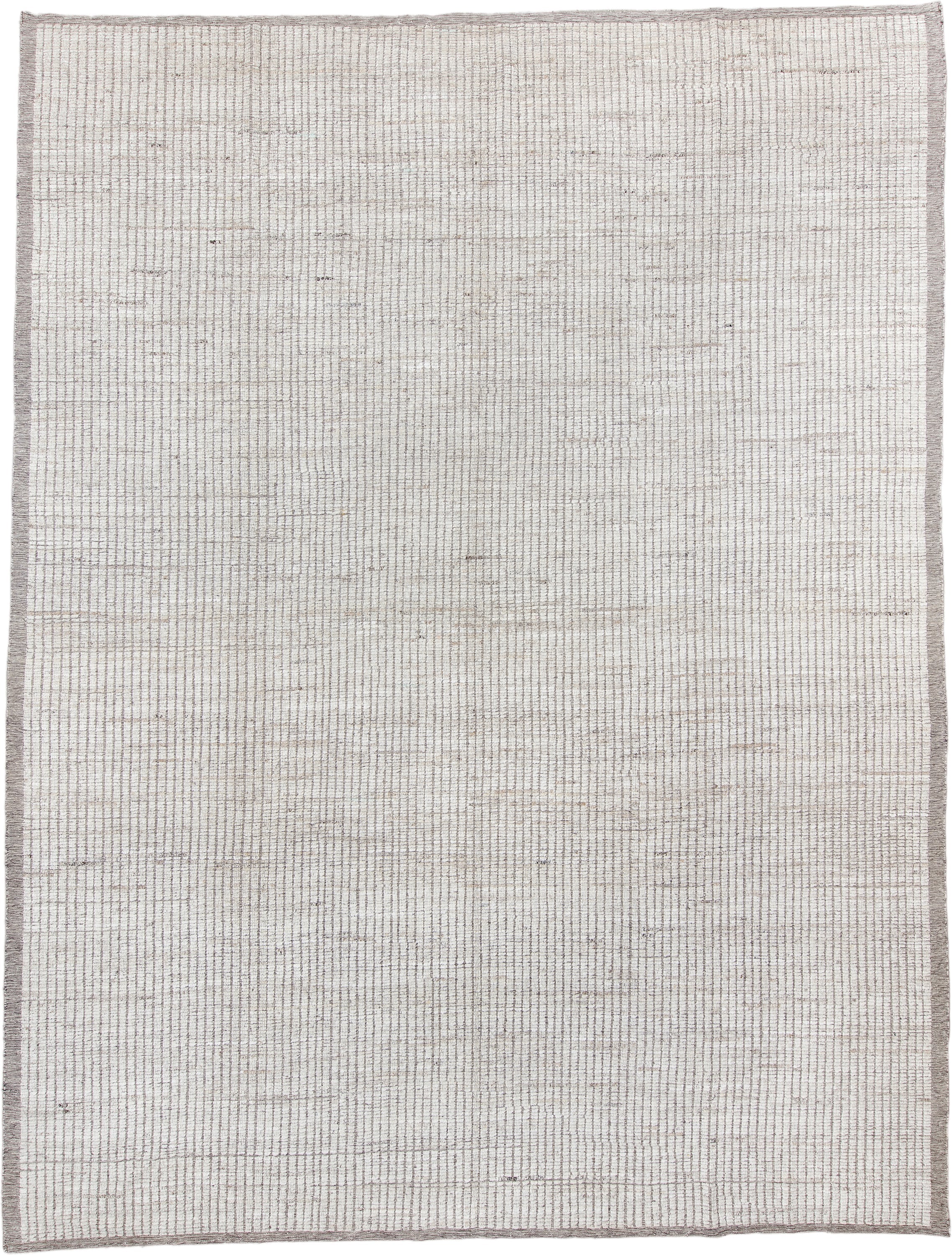 10' x 14' one-of-a-kind handmade vintage Tulu large size rug. Color palette: ivory, taupe, beige, gray