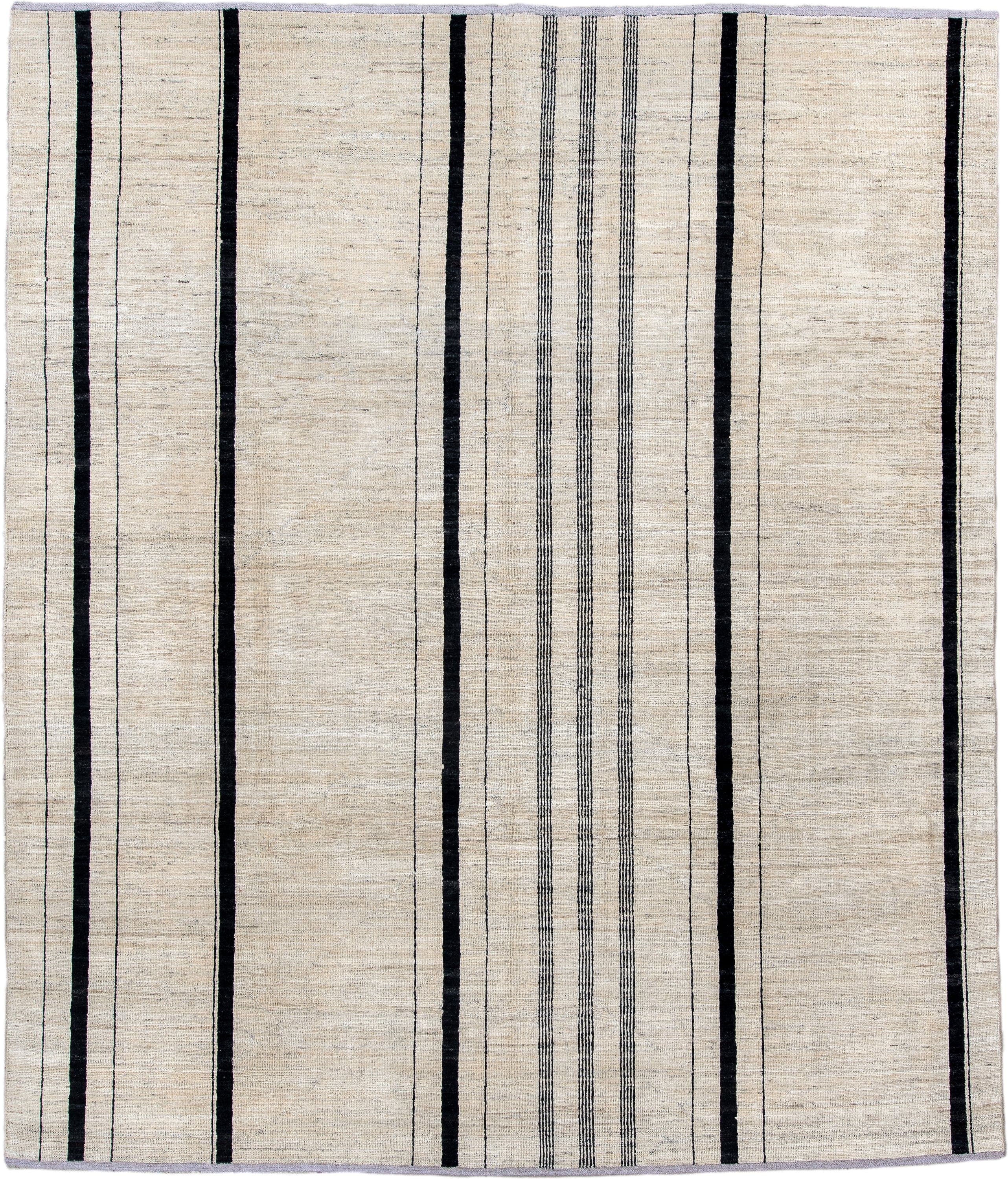 8' x 9' one-of-a-kind handmade vintage Tulu rug. Color palette: ivory, charcoal, ebony, cream, taupe, gray, black, beige
