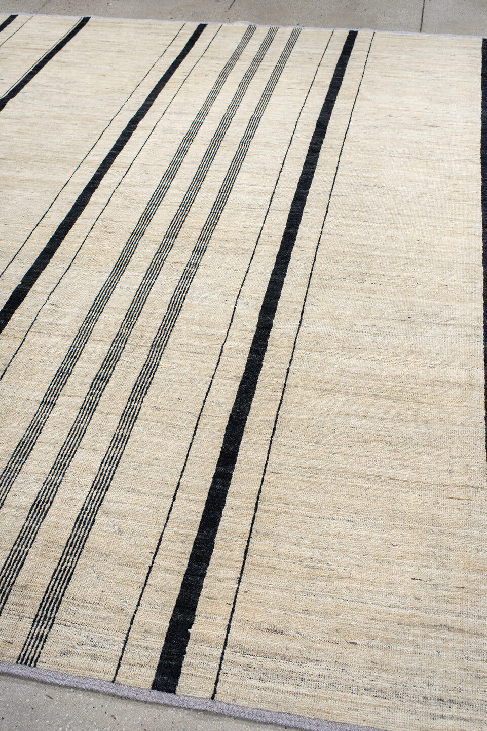 8' x 9' one-of-a-kind handmade vintage Tulu rug. Color palette: ivory, charcoal, ebony, cream, taupe, gray, black, beige