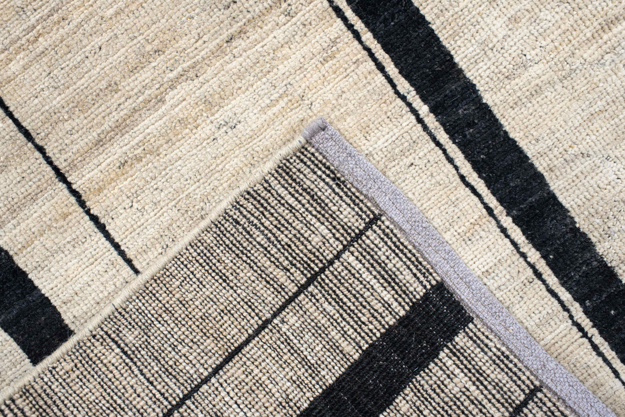 8' x 9' one-of-a-kind handmade vintage Tulu rug. Color palette: ivory, charcoal, ebony, cream, taupe, gray, black, beige