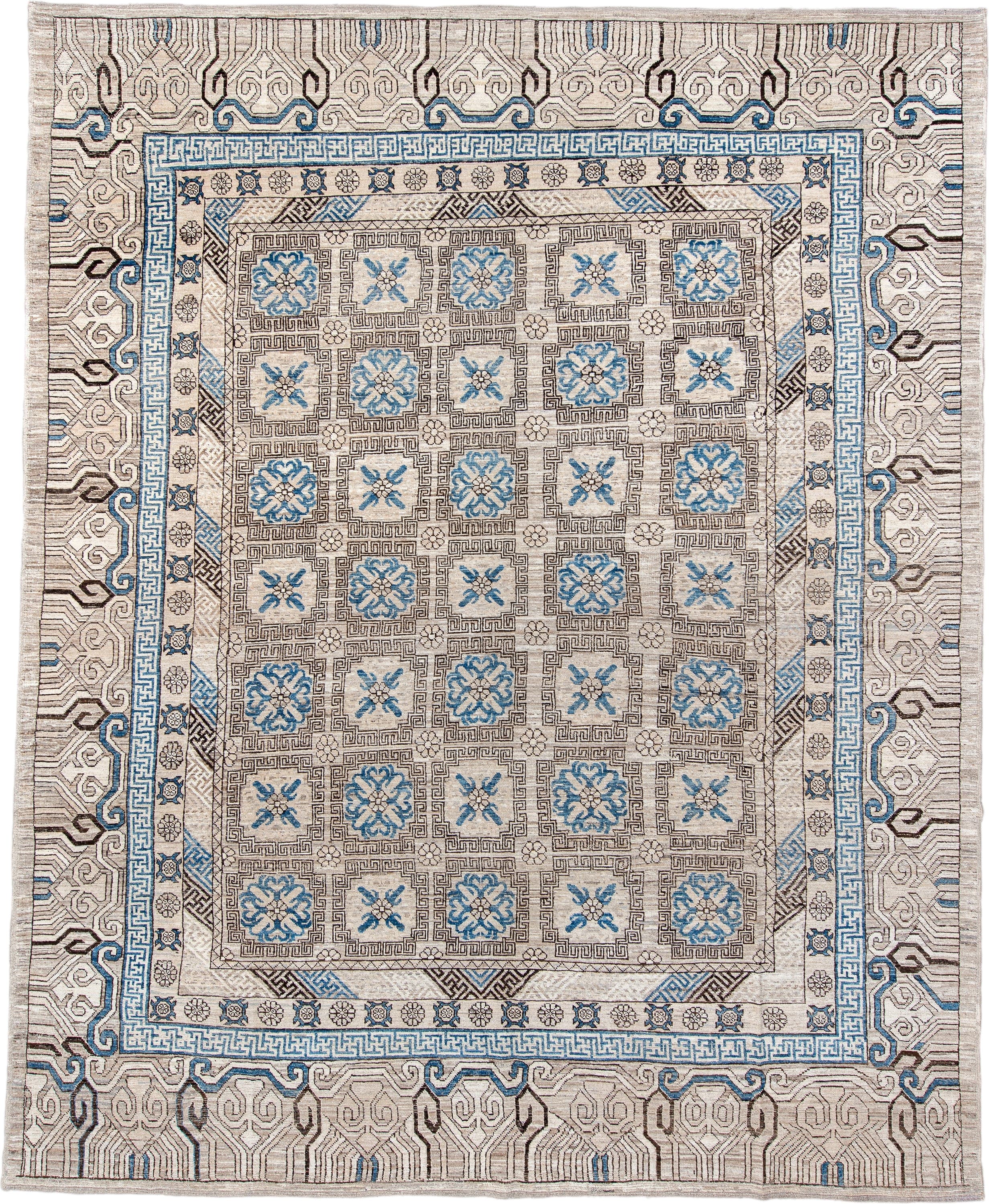 11' x 13' one-of-a-kind handmade vintage Khotan oversize rug. Color palette: ivory, sky_blue, taupe, charcoal, cream