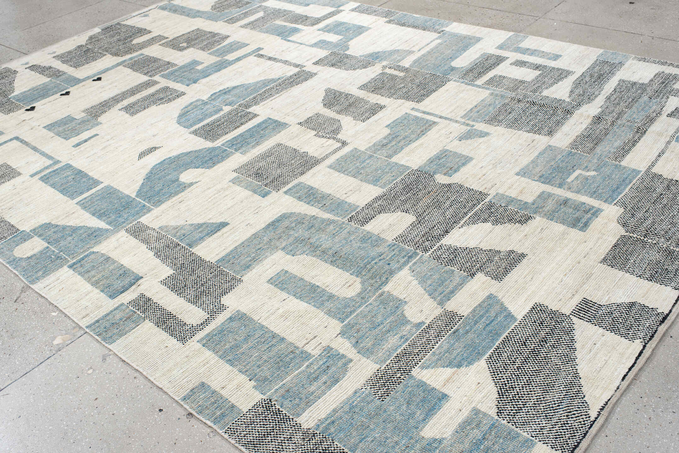 9' x 12' one-of-a-kind handmade vintage Tulu large size rug. Color palette: ivory, sky blue, charcoal, cream, slate