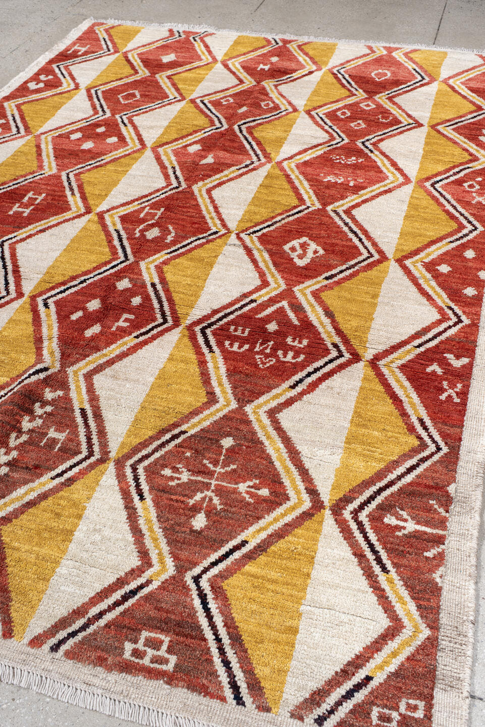 6' x 9' one-of-a-kind handmade vintage Tulu medium size rug. Color palette: rust, ivory, gold, charcoal, saffron, terracotta