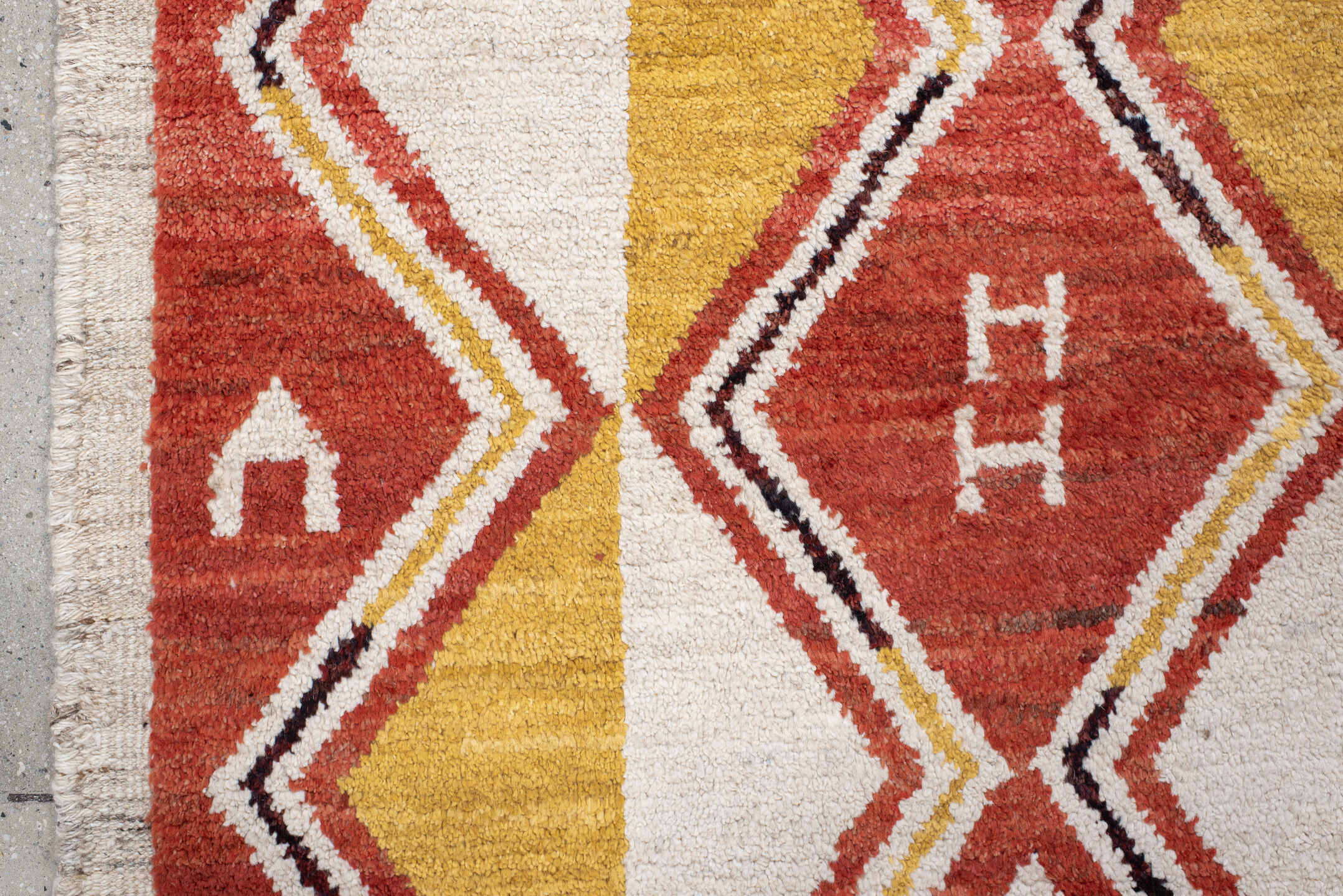 6' x 9' one-of-a-kind handmade vintage Tulu medium size rug. Color palette: rust, ivory, gold, charcoal, saffron, terracotta