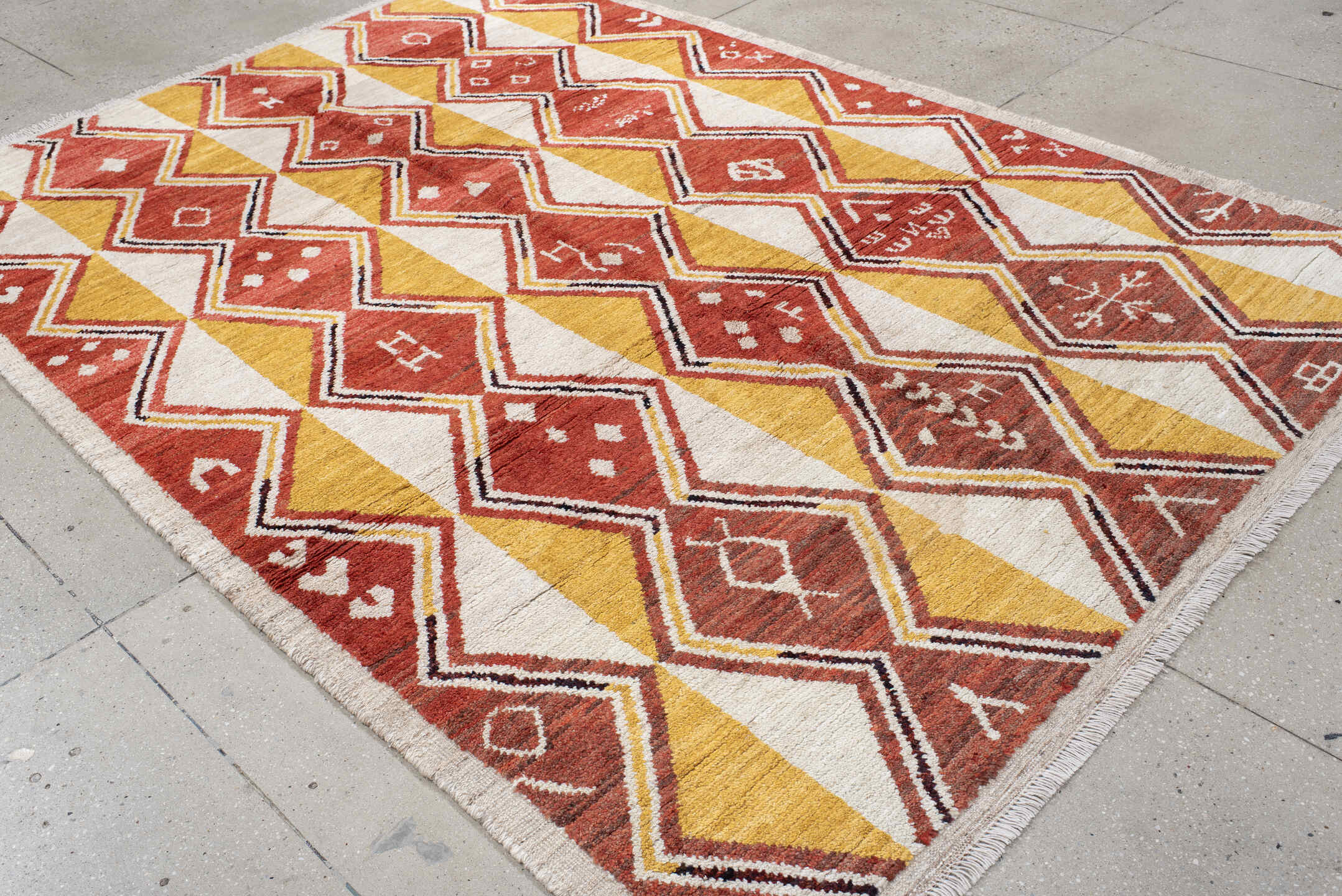 6' x 9' one-of-a-kind handmade vintage Tulu medium size rug. Color palette: rust, ivory, gold, charcoal, saffron, terracotta