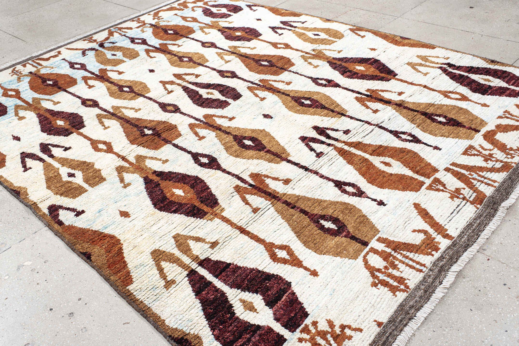 8' x 10' one-of-a-kind handmade vintage Tulu large size rug. Color palette: ivory, camel, rust, burgundy, sky_blue, taupe