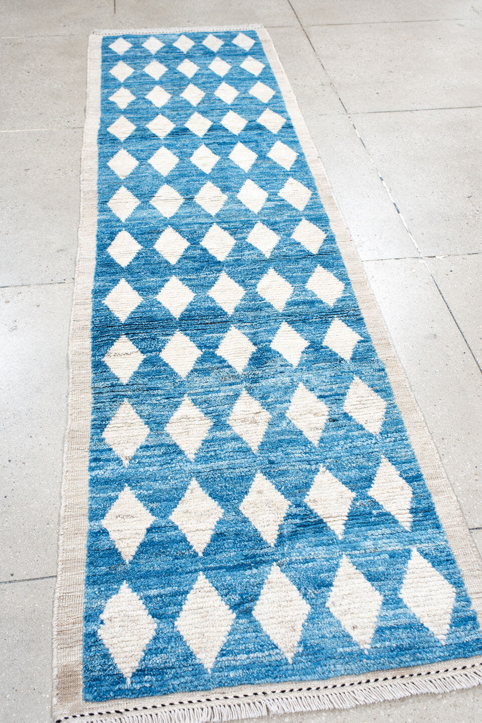 2' x 10' one-of-a-kind handmade vintage Tulu runner rug. Color palette: blue, ivory, cream
