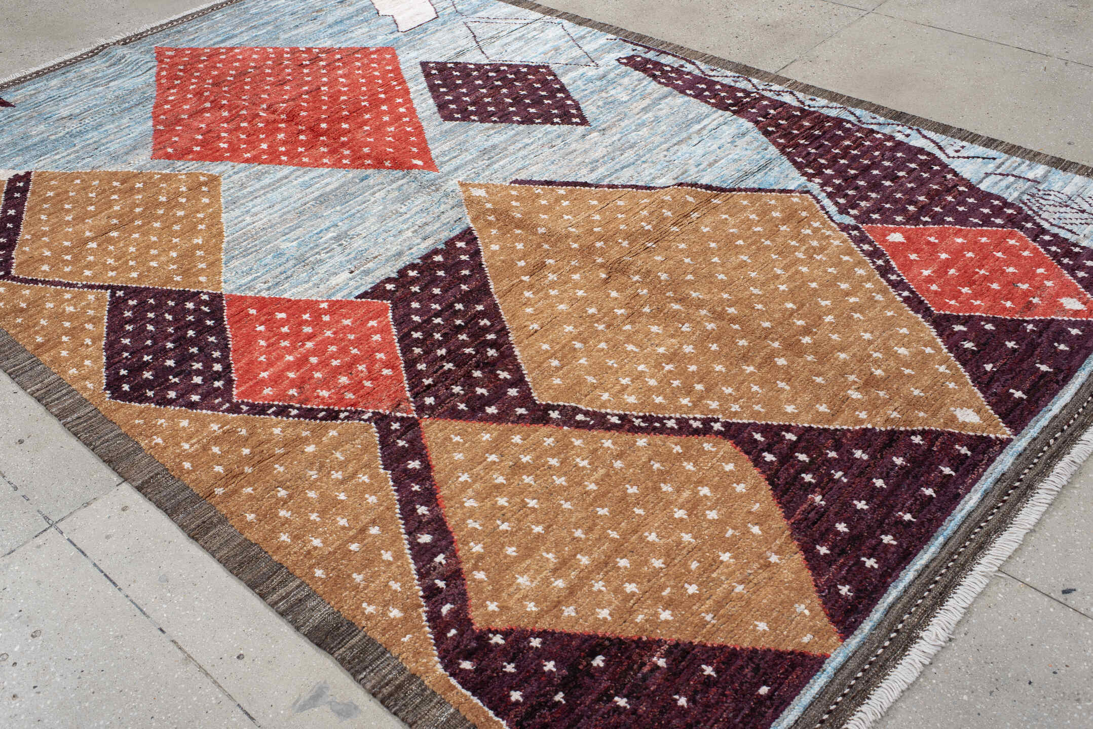 6' x 9' one-of-a-kind handmade vintage Tulu large size rug. Color palette: light blue, camel, plum, rust, ivory, charcoal