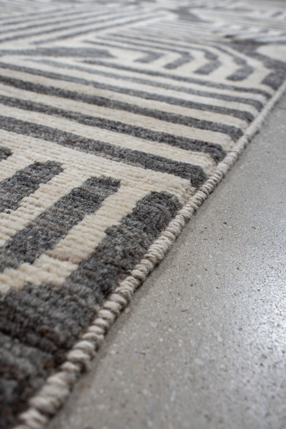 6' x 9' one-of-a-kind handmade vintage Tulu large size rug. Color palette: ivory, charcoal, cream, gray, black