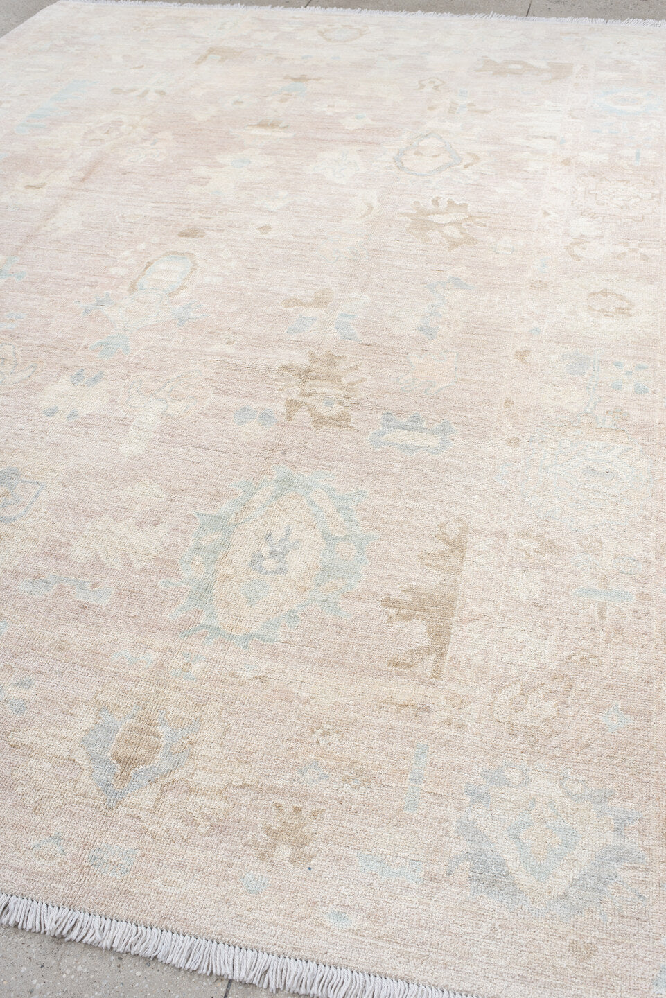 8' x 12' one-of-a-kind handmade vintage Oushak large size rug. Color palette: ivory, cream, blush, pale blue, beige, sand