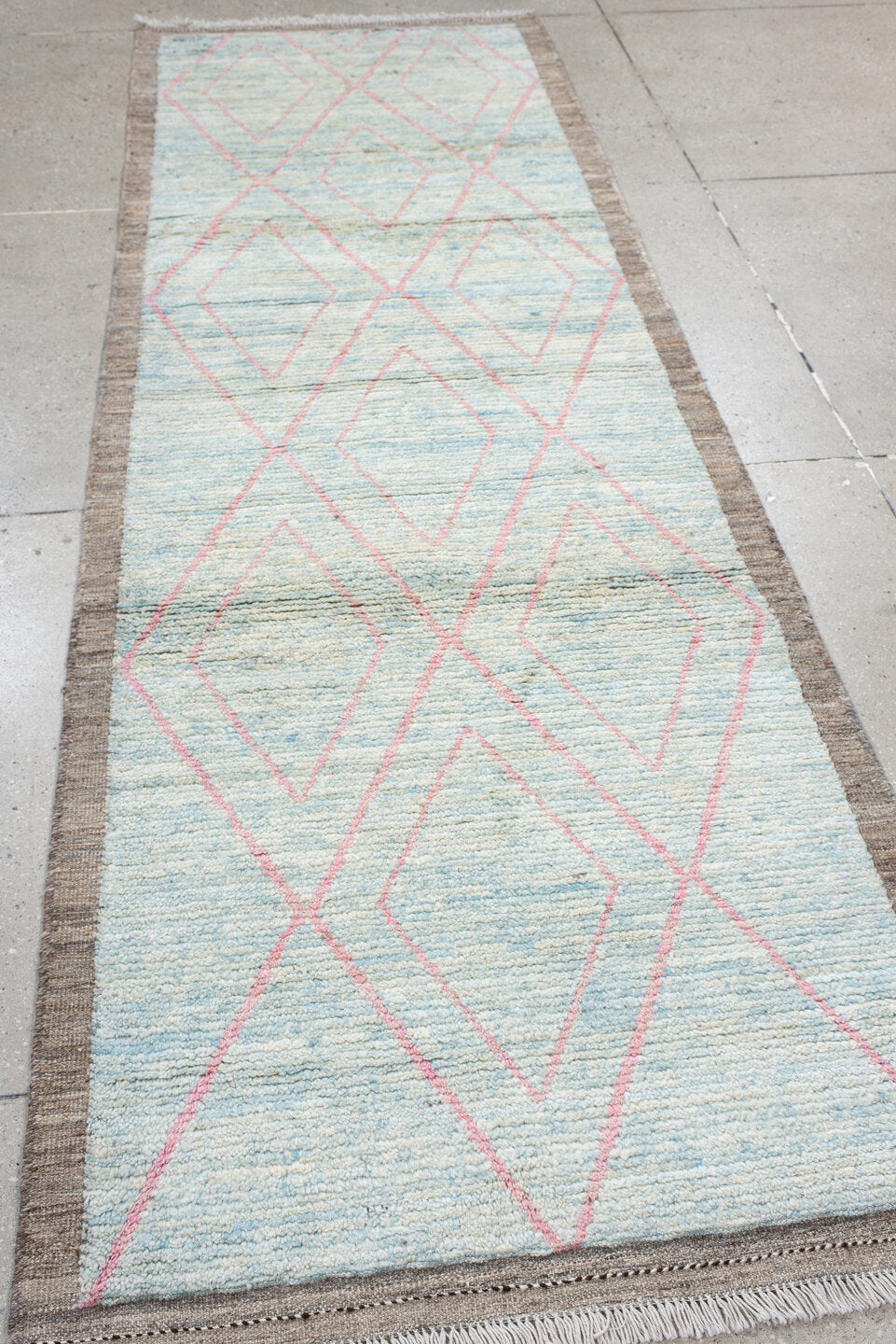 3' x 9' one-of-a-kind handmade vintage Tulu runner rug. Color palette: gray, pink, light gray, off-white, light blue