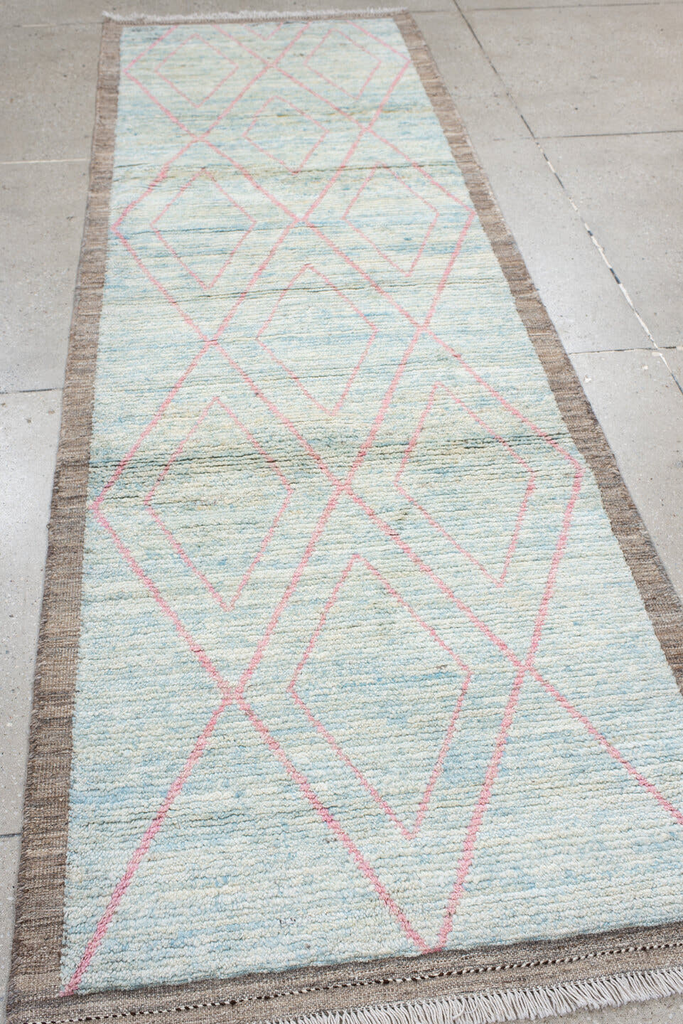3' x 9' one-of-a-kind handmade vintage Tulu runner rug. Color palette: ivory, pale blue, taupe, blush, charcoal, light blue