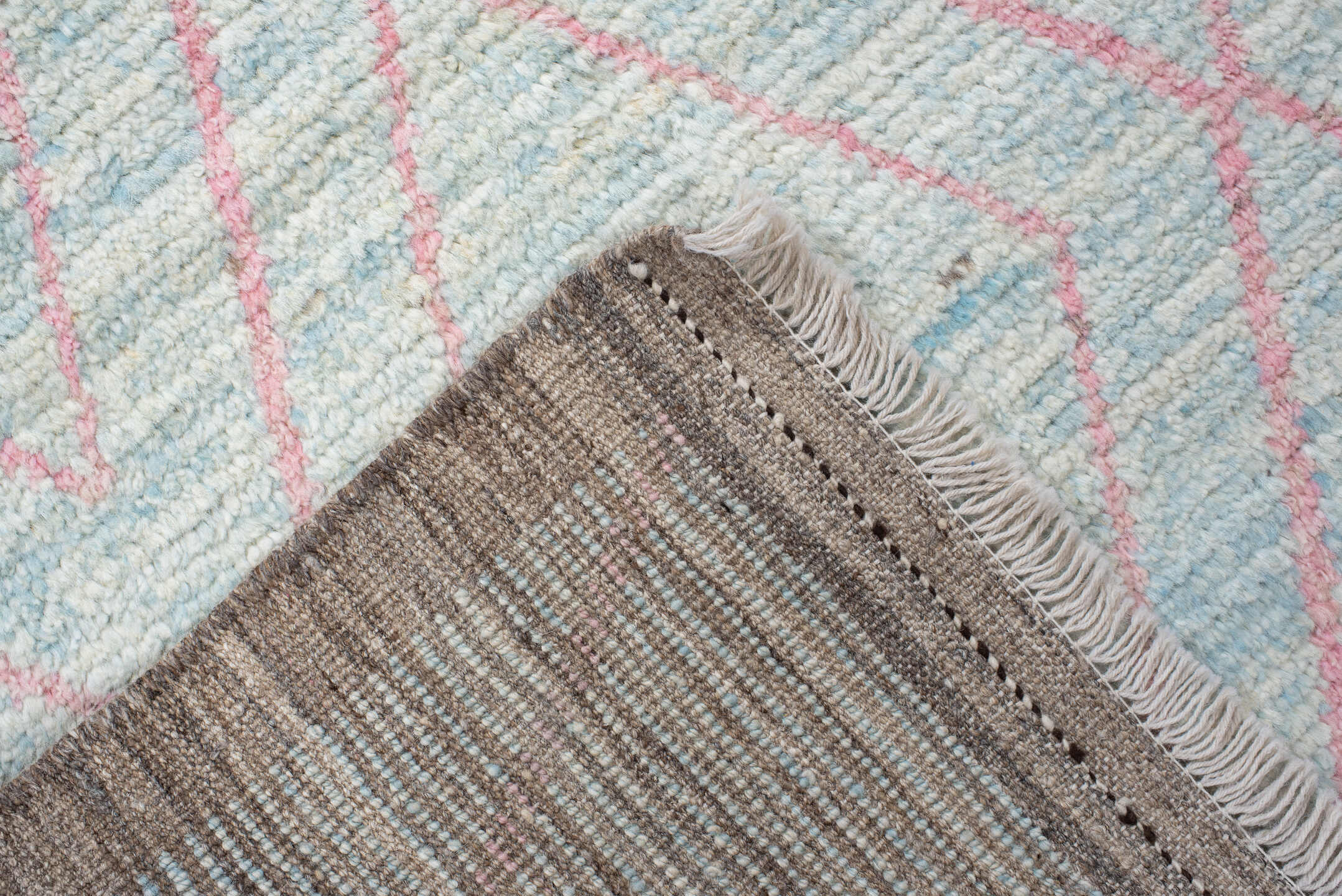 3' x 9' one-of-a-kind handmade vintage Tulu runner rug. Color palette: gray, pink, light gray, off-white, light blue