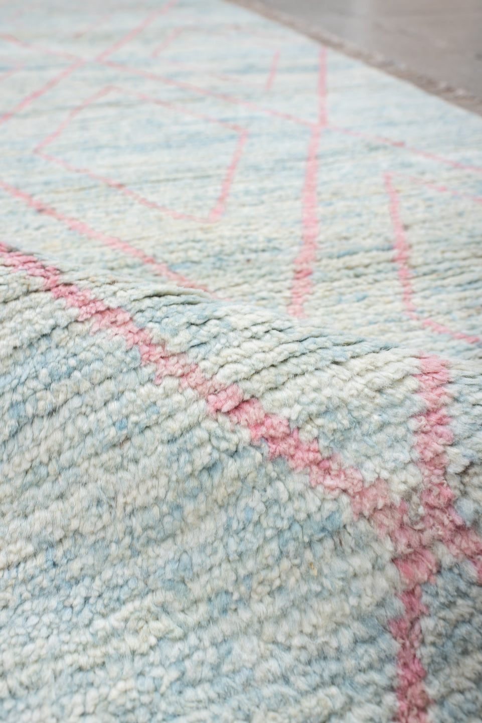 3' x 9' one-of-a-kind handmade vintage Tulu runner rug. Color palette: gray, pink, light gray, off-white, light blue