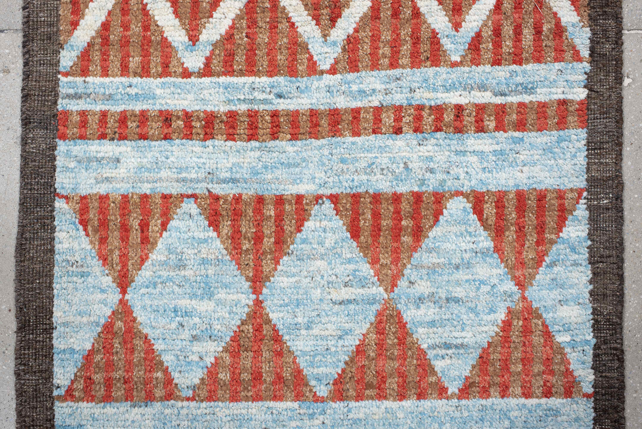 3' x 16' one-of-a-kind handmade vintage Tulu runner rug. Color palette: rust, ivory, sky blue, charcoal, terracotta, brown