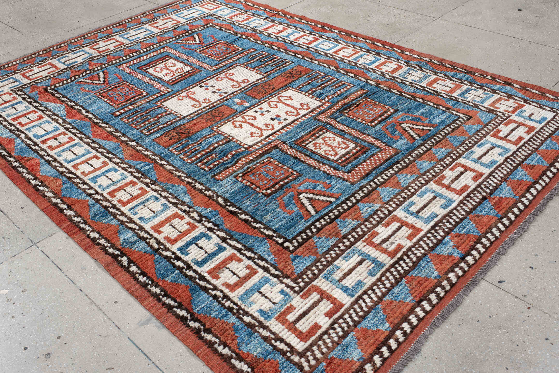 7' x 9' one-of-a-kind handmade vintage Tulu large size rug. Color palette: sky blue, rust, ivory, dark brown, brick, black
