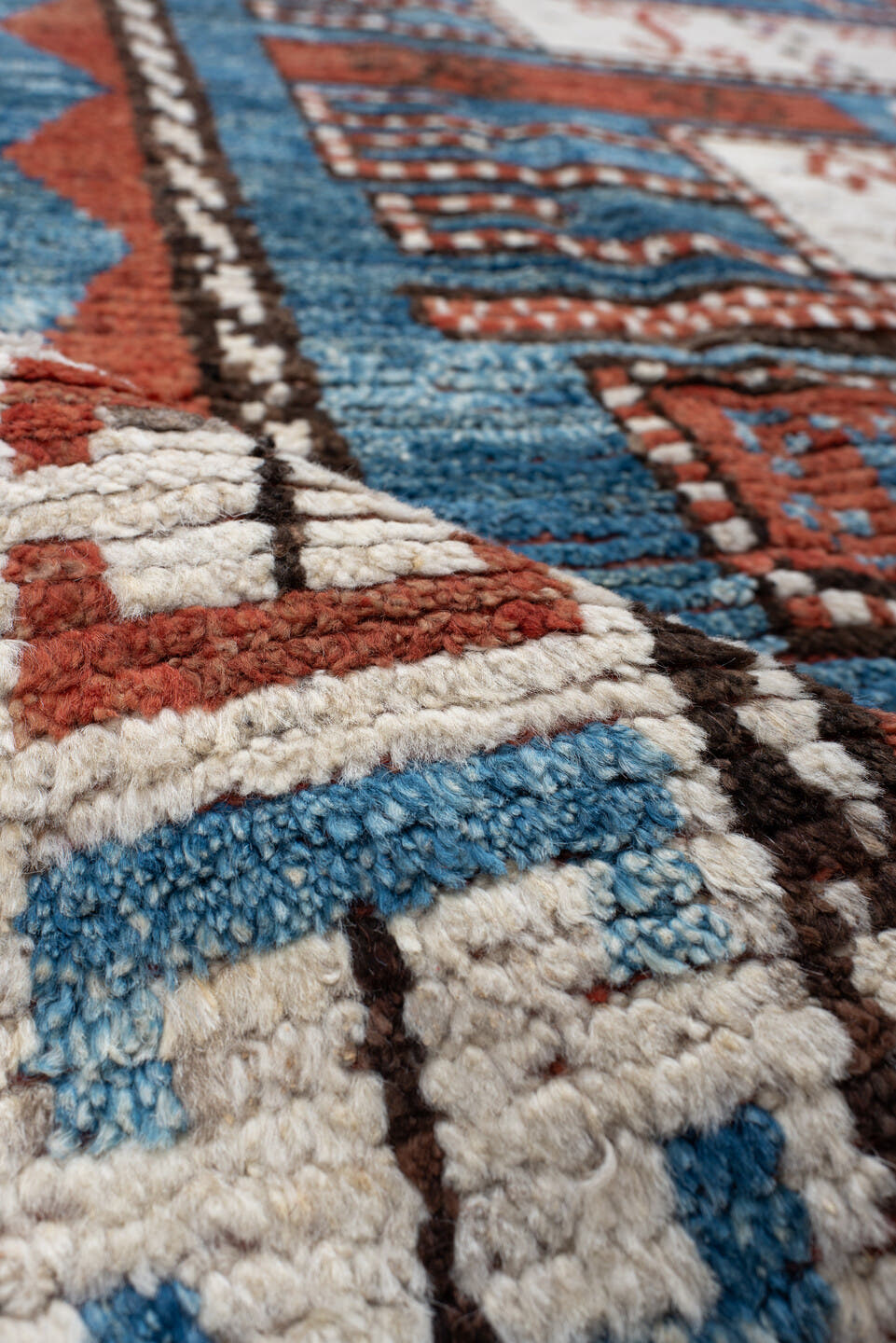 7' x 9' one-of-a-kind handmade vintage Tulu large size rug. Color palette: sky blue, rust, ivory, dark brown, brick, black