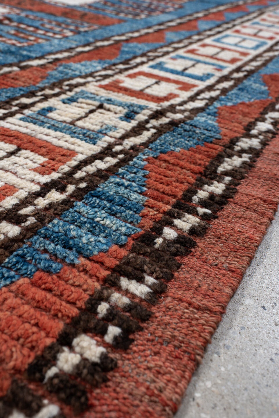 7' x 9' one-of-a-kind handmade vintage Tulu large size rug. Color palette: sky blue, rust, ivory, dark brown, brick, black