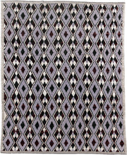 7' x 9' one-of-a-kind handmade vintage Tulu rug. Color palette: lavender, charcoal, ivory, burgundy, light gray, gray, black