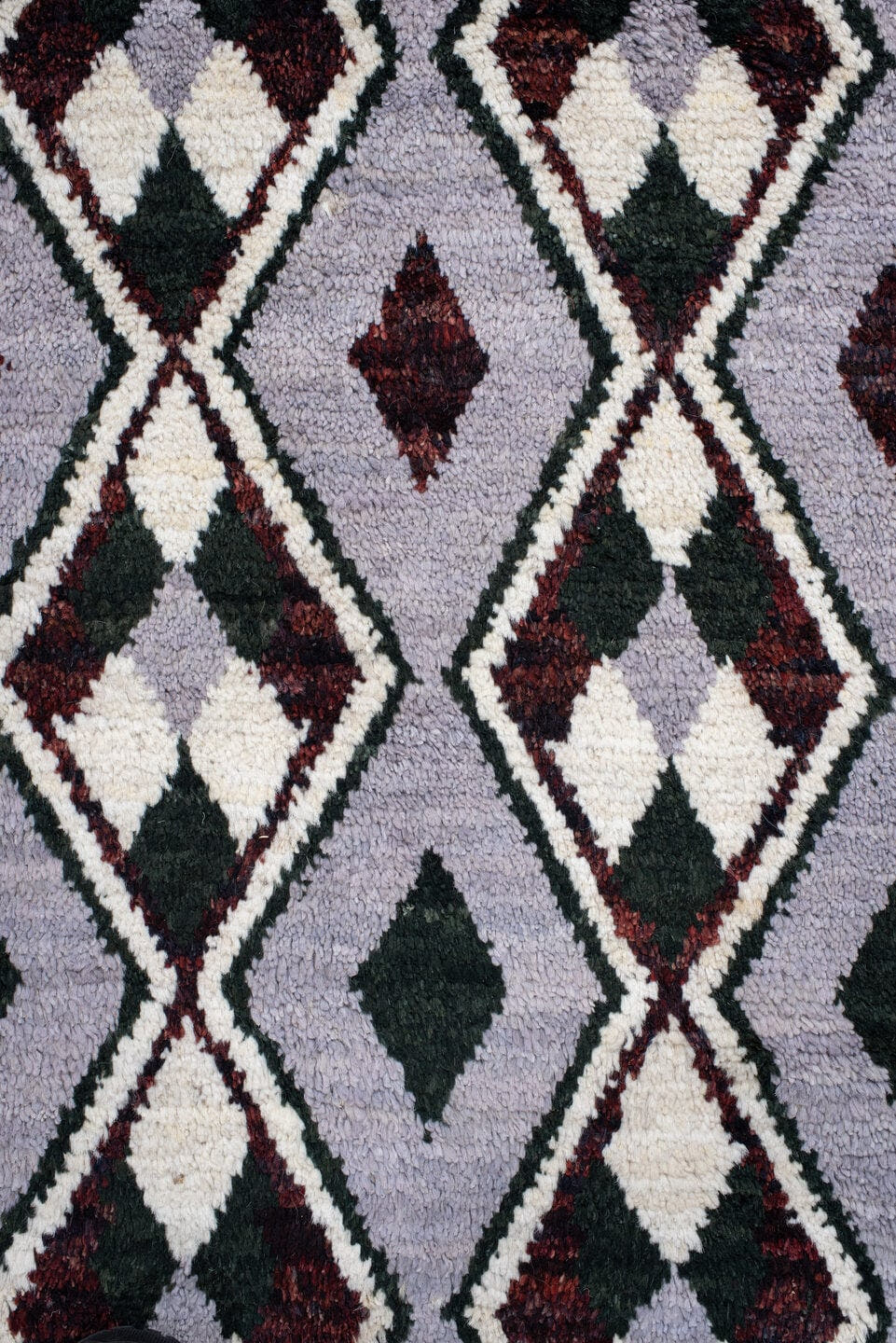 7' x 9' one-of-a-kind handmade vintage Tulu rug. Color palette: lavender, charcoal, ivory, burgundy, light gray, gray, black