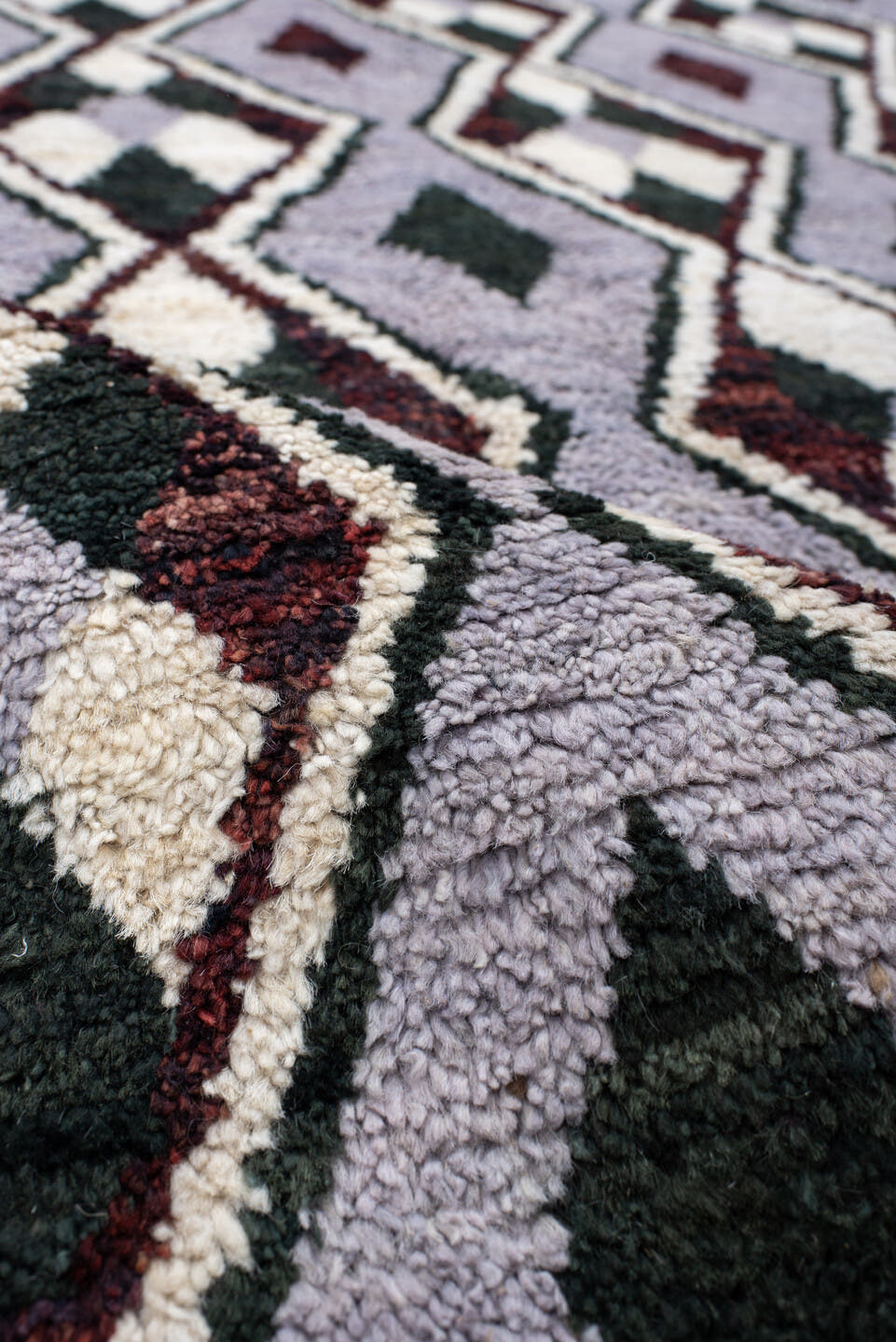 7' x 9' one-of-a-kind handmade vintage Tulu rug. Color palette: lavender, charcoal, ivory, burgundy, light gray, gray, black
