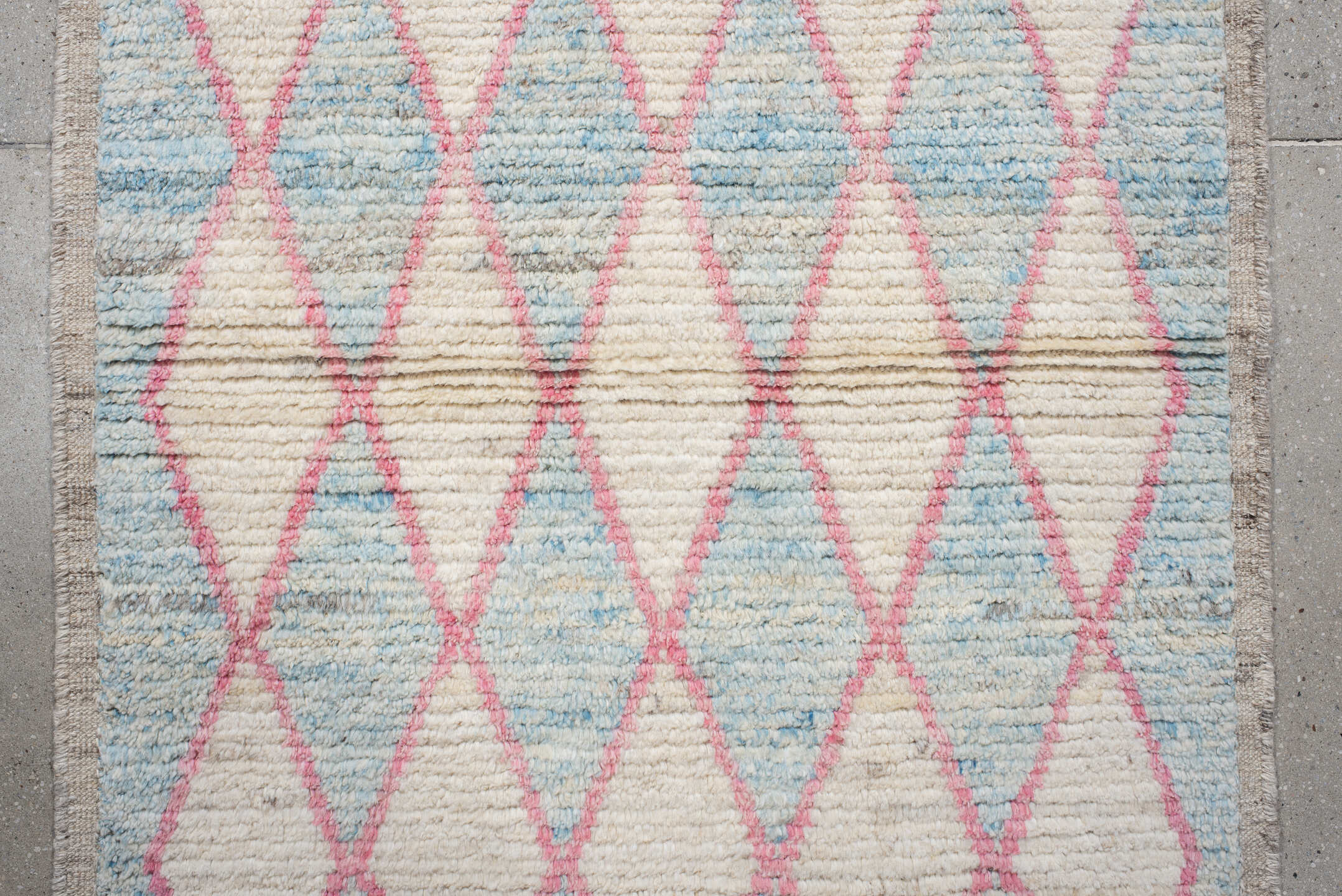 3' x 9' one-of-a-kind handmade vintage Tulu runner rug. Color palette: ivory, sky blue, pink, taupe, light blue, beige, gray