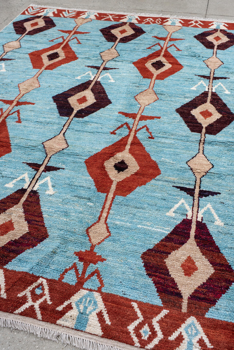 6' x 9' one-of-a-kind handmade vintage Tulu medium size rug. Color palette: sky blue, rust, ivory, plum, cream, terra cotta