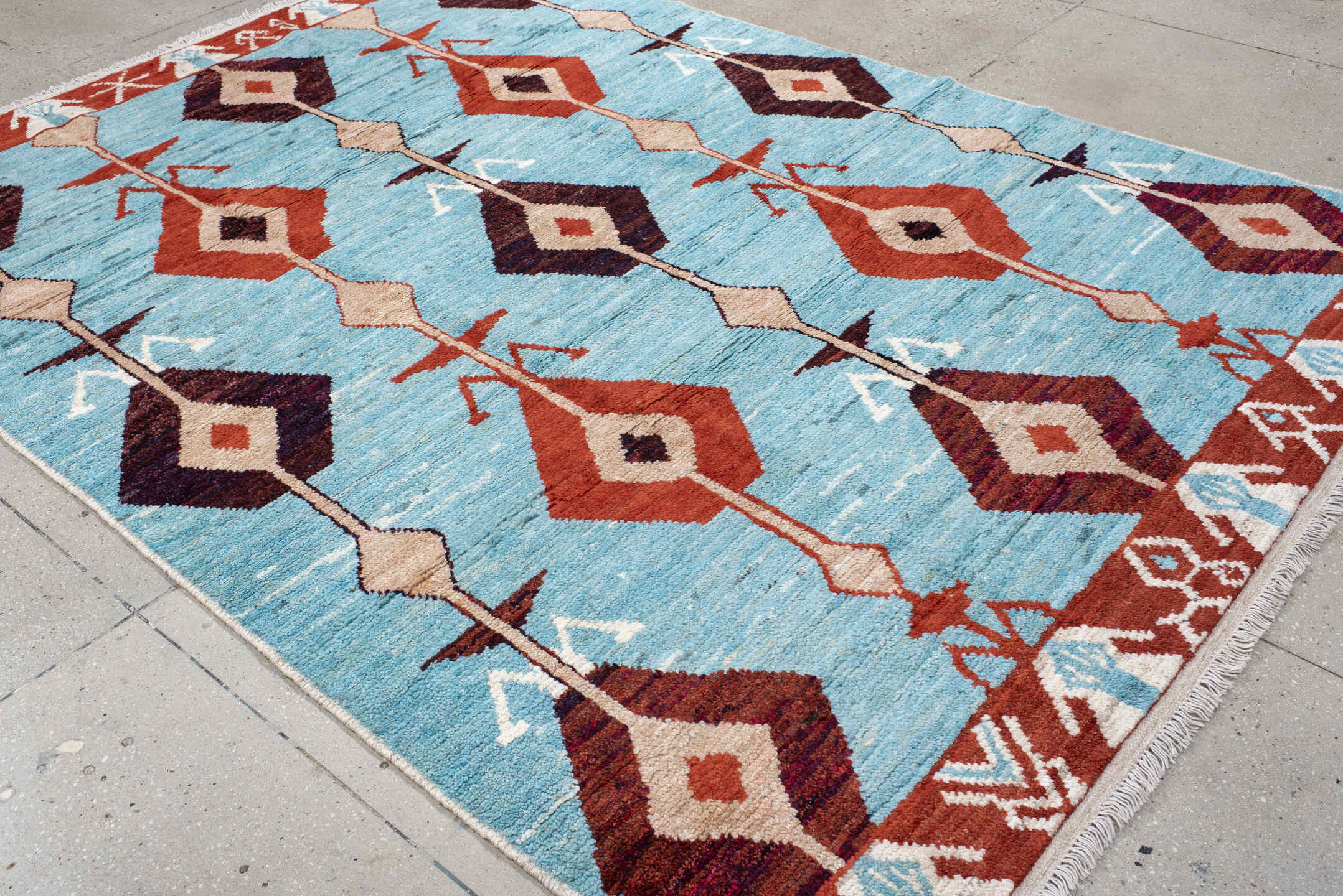 6' x 9' one-of-a-kind handmade vintage Tulu medium size rug. Color palette: sky blue, rust, ivory, plum, cream, terra cotta