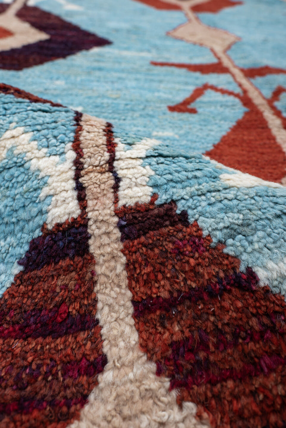 6' x 9' one-of-a-kind handmade vintage Tulu medium size rug. Color palette: sky blue, rust, ivory, plum, cream, terra cotta