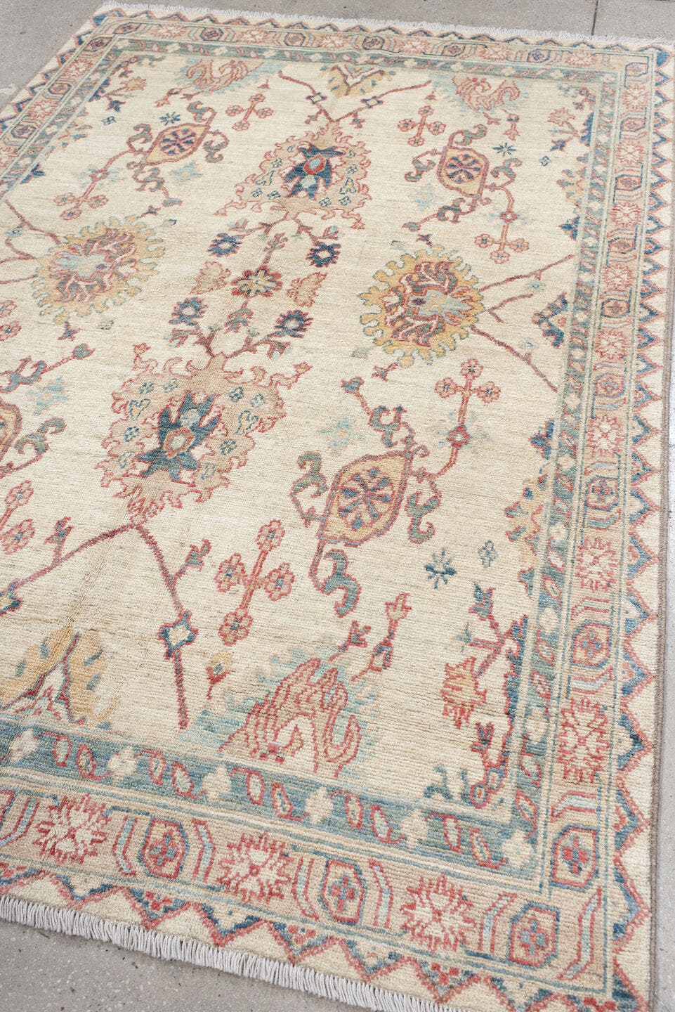 5' x 8' one-of-a-kind handmade vintage Oushak medium size rug. Color palette: ivory, sky blue, coral, pale gold, taupe