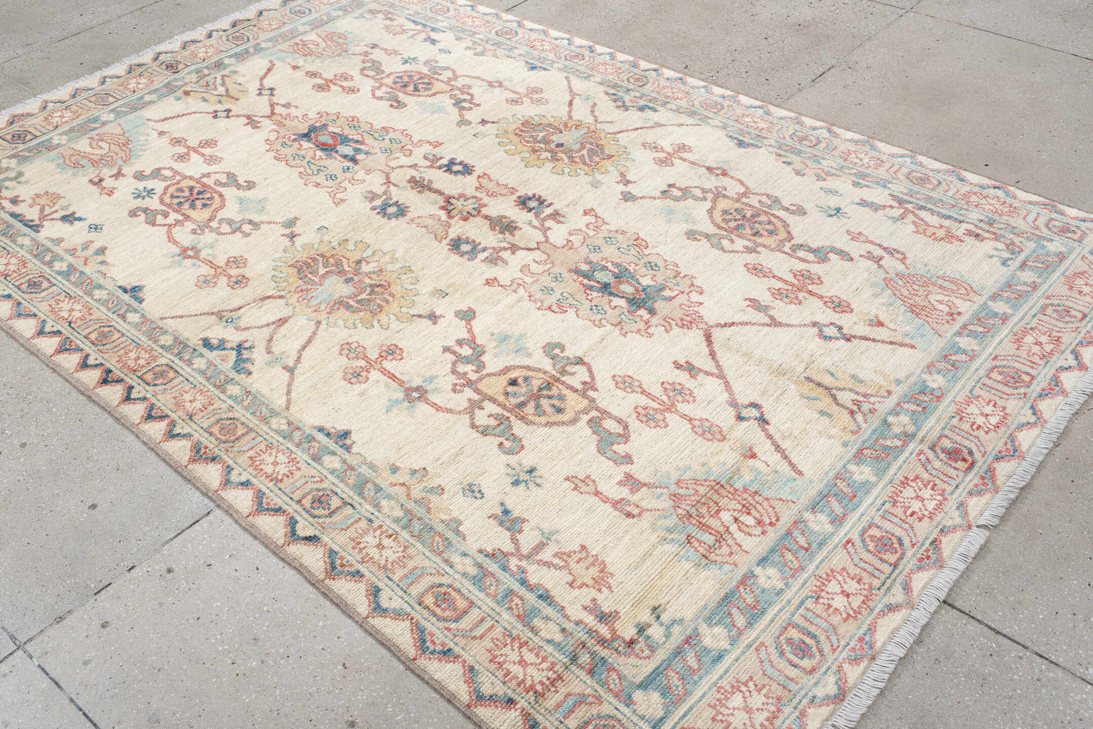 5' x 8' one-of-a-kind handmade vintage Oushak medium size rug. Color palette: ivory, sky blue, coral, pale gold, taupe