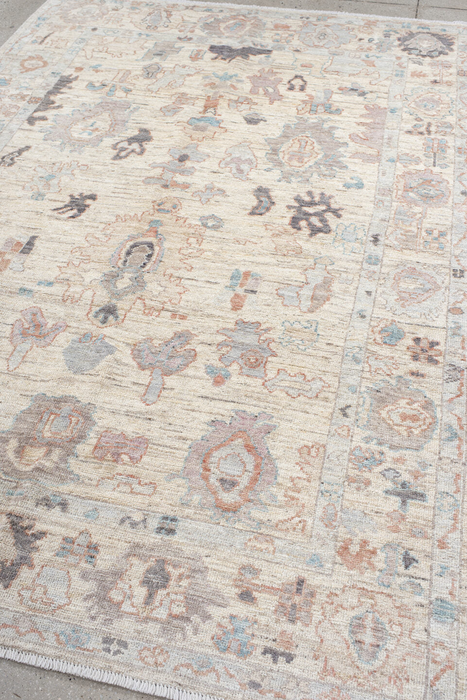 6' x 8' one-of-a-kind handmade vintage Oushak medium size rug. Color palette: ivory, cream, taupe, pale blue, blush