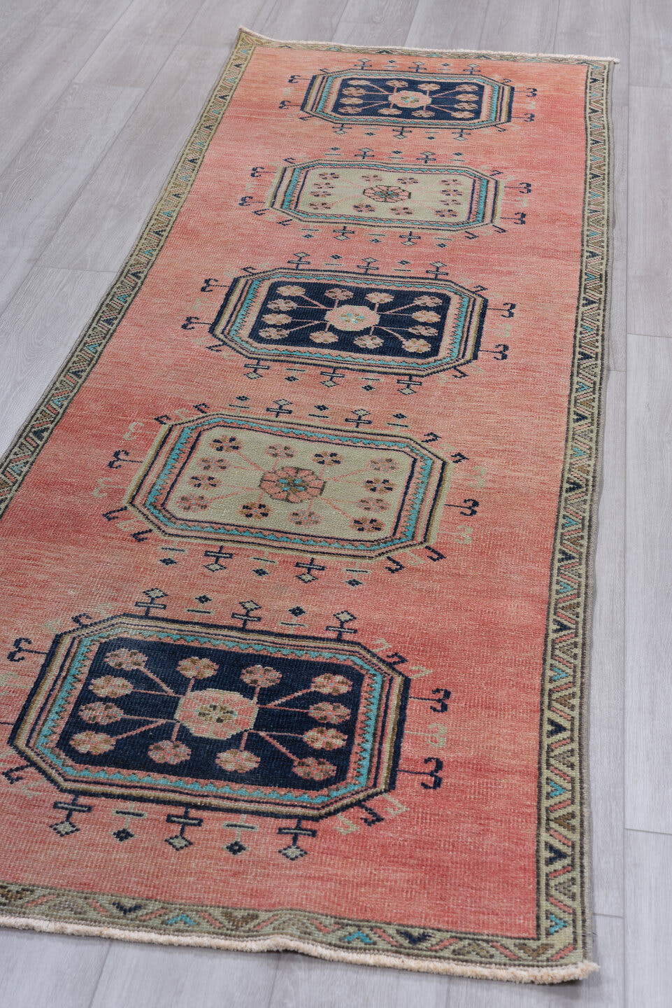 3' x 9' one-of-a-kind handmade antique Oushak runner rug. Color palette: rose, navy, ivory, aqua, taupe, charcoal, pink, red