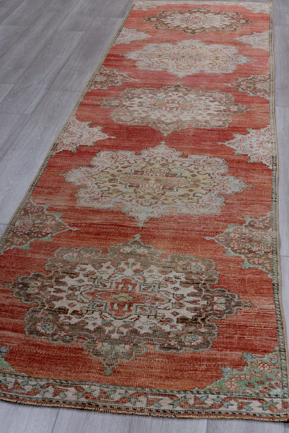 3' x 12' one-of-a-kind handmade antique Oushak runner rug. Color palette: coral, ivory, taupe, aqua, brown, rust, terracotta